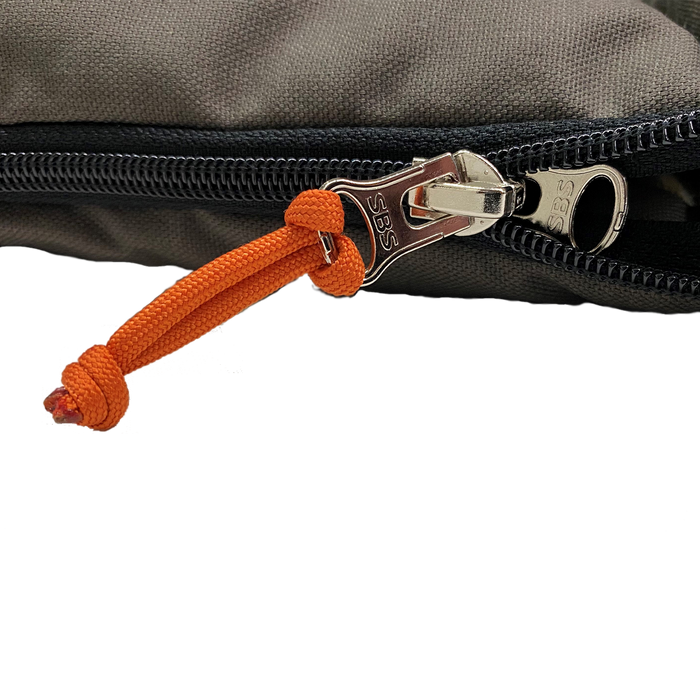 Close-up of a zipper featuring an orange pull tab on a durable gray fabric pouch.