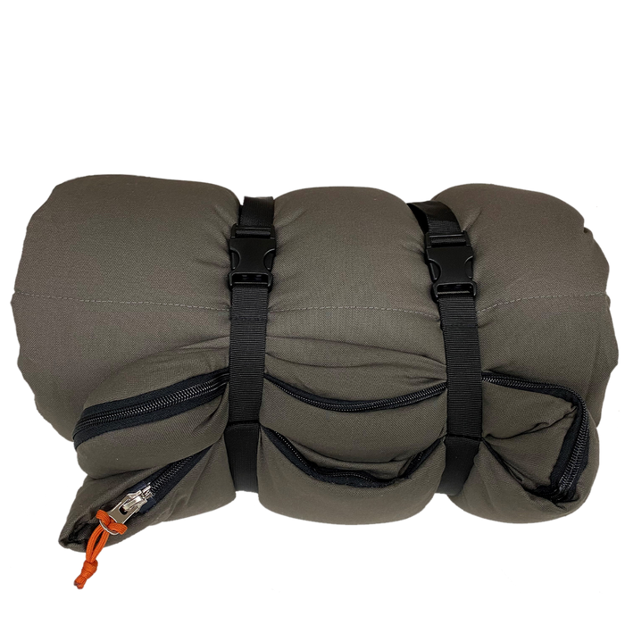 Compact gray travel pillow with zipper pockets and adjustable straps for easy carry.