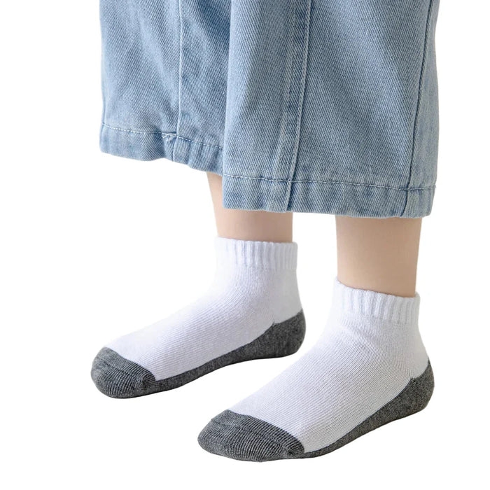 Five pairs of Habicare cotton socks for boys and girls aged 1 to 12, featuring colorful, comfortable designs for kids' everyday wear.