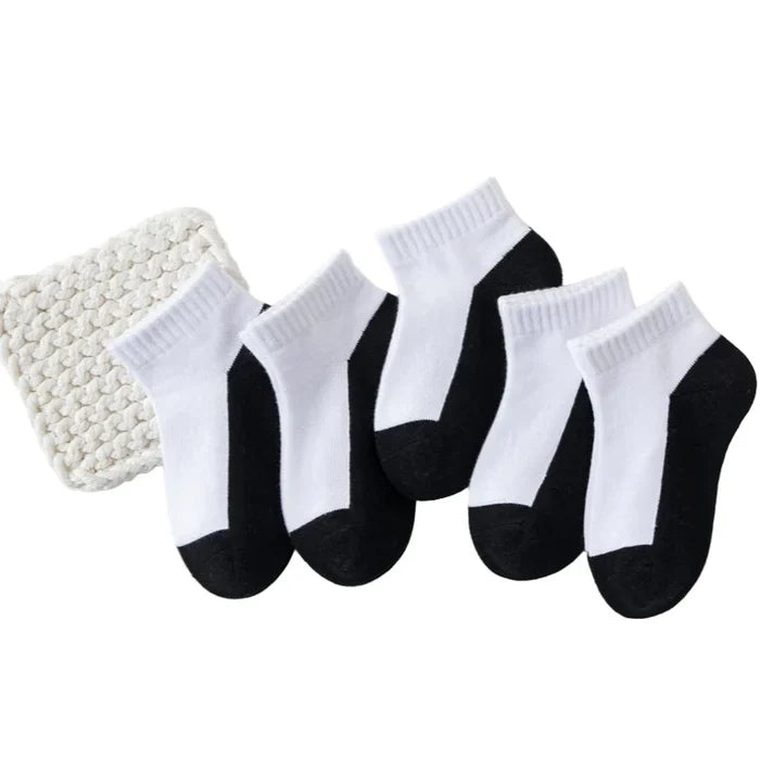 Five pairs of Habicare cotton socks for boys and girls aged 1 to 12, shown in various colors and sizes.