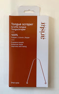 Arista tongue scraper packaging on a beige background