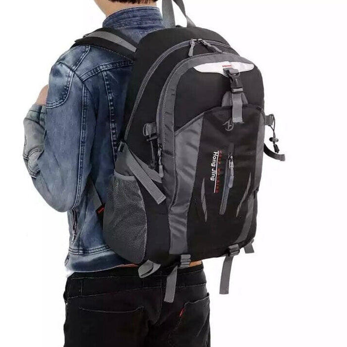 Black and grey 9eight5 backpack with adjustable straps and multiple compartments, designed for everyday use.