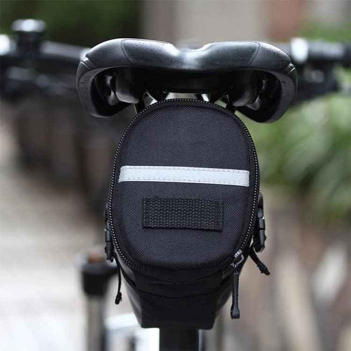 ECOTREK bicycle saddle bag attached to a bike seat, lightweight velcro design, ideal for MTB, road bike, and e-bike cycling accessories.