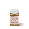 Jar of Happy Valley Honey Borage Field Honey, gourmet raw honey with golden color and floral honeycomb texture visible.