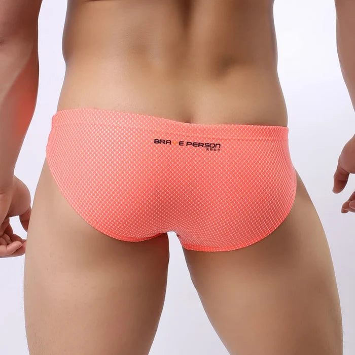 Colorful men's briefs made of high-quality nylon with a snug fit, featuring bold design and comfortable waistband.