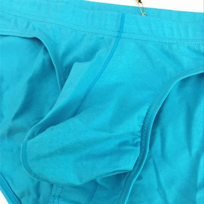 Close-up of men's briefs by ShopHub NZ, featuring a cotton fabric, U convex pouch, low waist design, and snug fit.