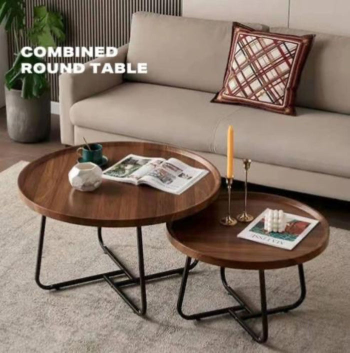Set of two nested round wooden coffee tables by sue-e furniture, featuring natural wood finish and modern design.