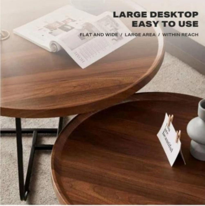 Set of two wooden nested round coffee tables by sue-e furniture, featuring natural wood finish and modern design.