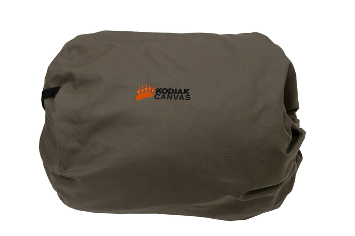 Kodiak Canvas storage bag in khaki, durable material, perfect for outdoor camping gear or equipment.