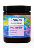 Soy candle with colorful label featuring 'CanDo' brand on a white background