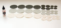 Assorted round fabric patches in gray, black, and beige with Tear Mender adhesive for quick repairs.