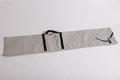 Gray fabric storage roll with black straps, ideal for organizing tools or equipment.