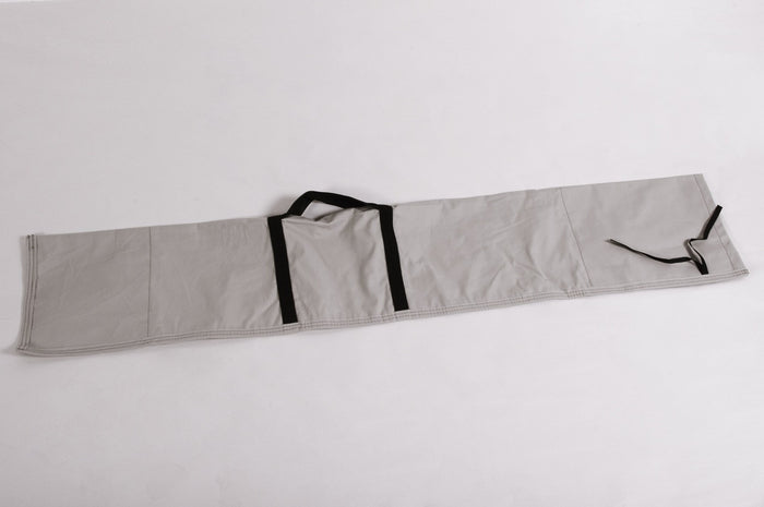 Gray fabric storage roll with black straps, ideal for organizing tools or equipment.
