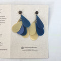blue and yellow earrings made from shampoo bottles
