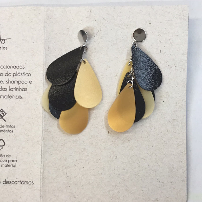 black and yellow earrings made from shampoo bottles