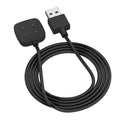 Fitbit Versa 4, Versa 3, Sense 2, and Sense charger by That Watch Shop showing a compact charging dock with cable and connector.