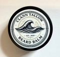 Clann Tallow beard balm container with wave design on a beige background