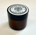 Brownglass  jar with black lid featuring 'Clann Tallow Luxury Skincare' on a white background