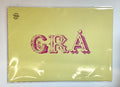 Packaged product with 'GRA' text on a yellow background