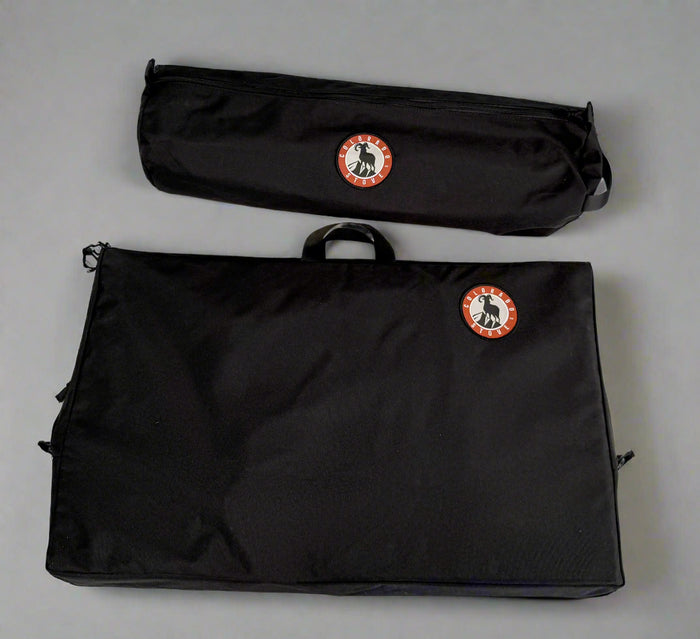 Set of black storage bags with logos, including a large flat bag and a cylindrical bag for versatile use.