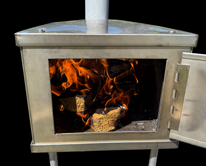 Stainless steel wood-burning stove with flames and logs visible inside, ideal for outdoor heating.