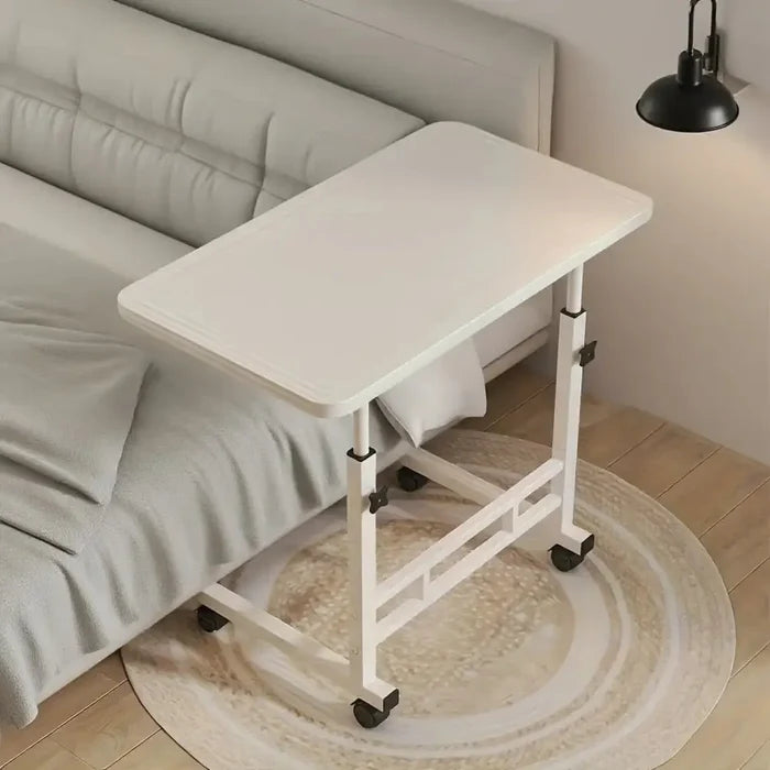 Habicare SS compact adjustable bedside work desk with four wheels, ideal for mobile use and versatile workspace.