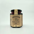 A jar of Crossogue Blackcurrant Jam with a label that includes the brand name, product name, and an award badge.
