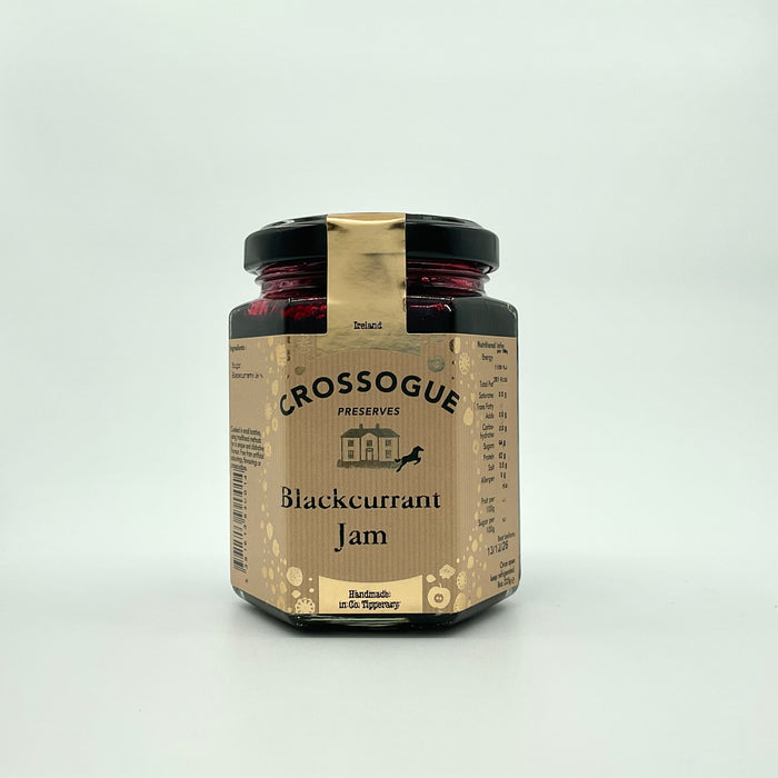 A jar of Crossogue Blackcurrant Jam with a label that includes the brand name, product name, and an award badge.