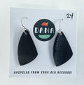 Black earrings on a card with 'Dana' branding and text about upcycling from records.
