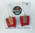 Red and gold earrings on a DANA branded card with text 'Upcycled from your old records!'.
