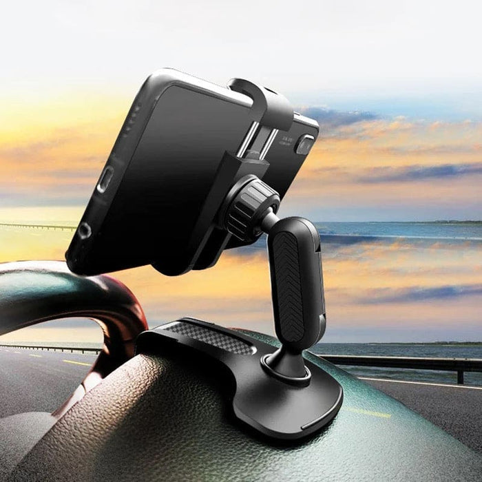 9eight5 dashboard hood phone holder attached to car dashboard, keeps phone secure and accessible while driving.