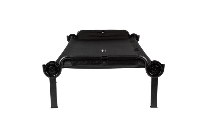 Black portable cot with sturdy frame and breathable fabric, ideal for camping and guest accommodations.
