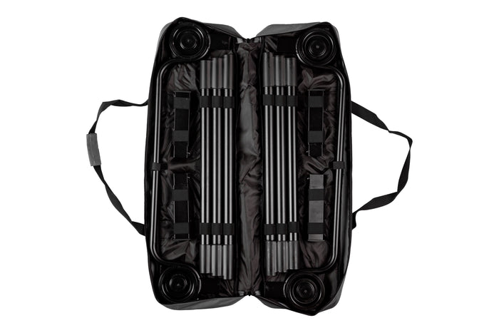 Black carrying case for portable equipment with wheels and sturdy straps, featuring organized interior compartments.