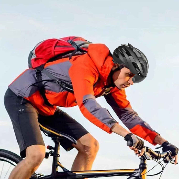 ECOTREK adult bicycle helmet with adjustable straps and removable goggles, shown in a sleek black design.
