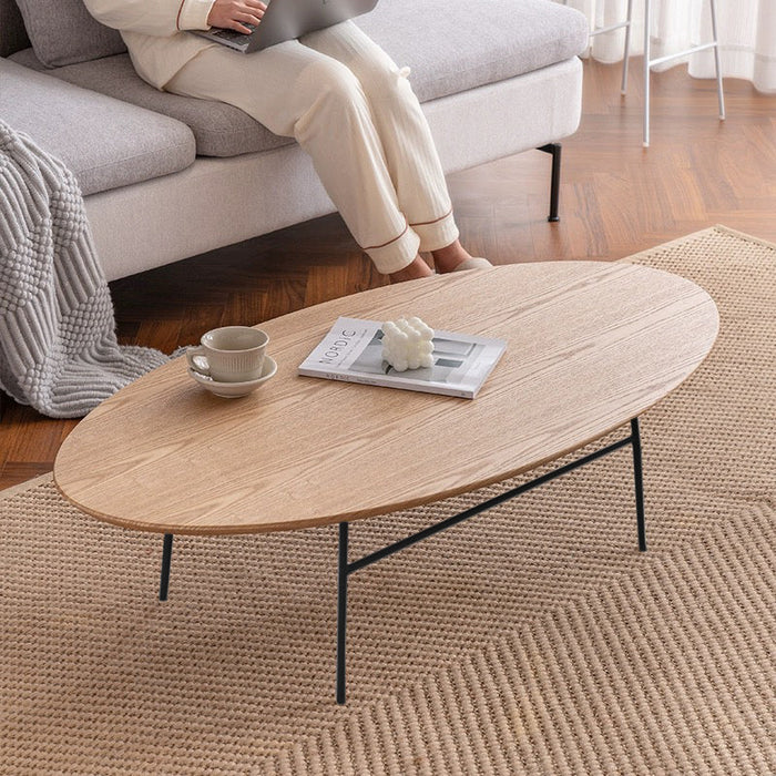Elegant oval wooden coffee table by sue-e furniture with a smooth finish and modern design, perfect for contemporary living rooms.