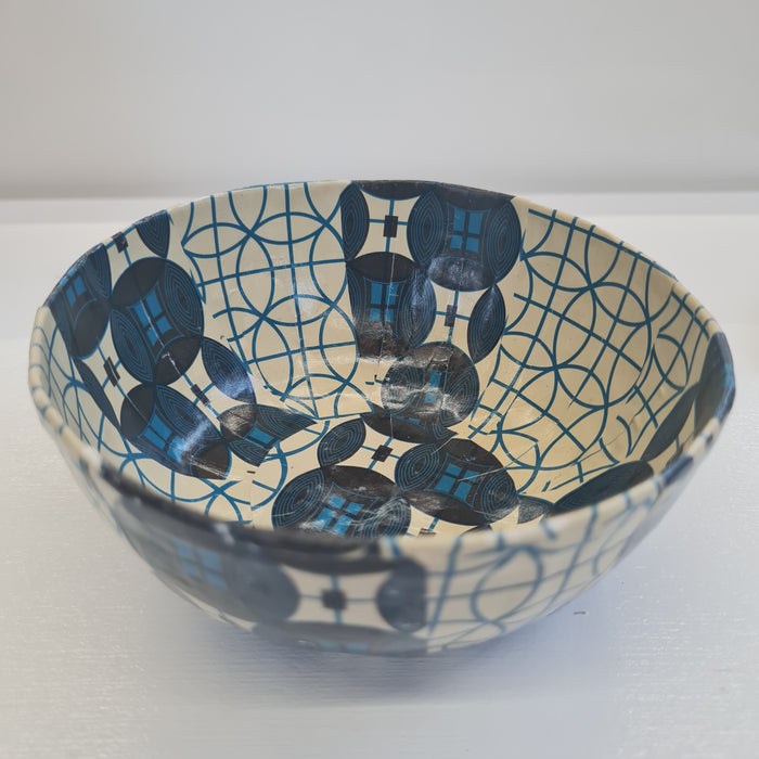 blue and beige paper mache bowl