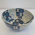 blue and beige paper mache bowl