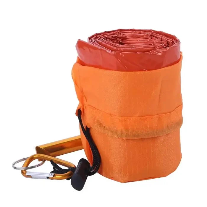 Orange Habicare emergency sleeping bag, lightweight SS survival gear for cold weather and emergency situations.