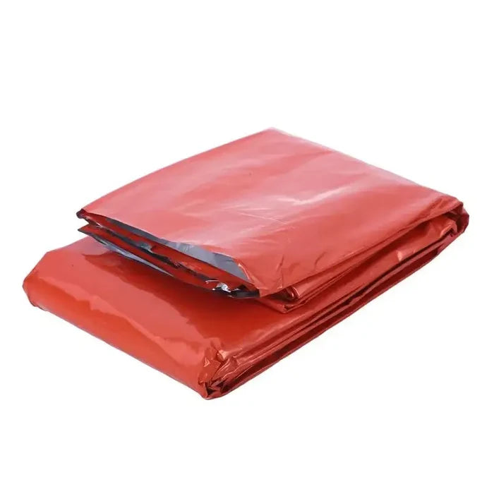 Orange Habicare SS emergency sleeping bag laid flat, lightweight and compact for outdoor survival and emergency situations.