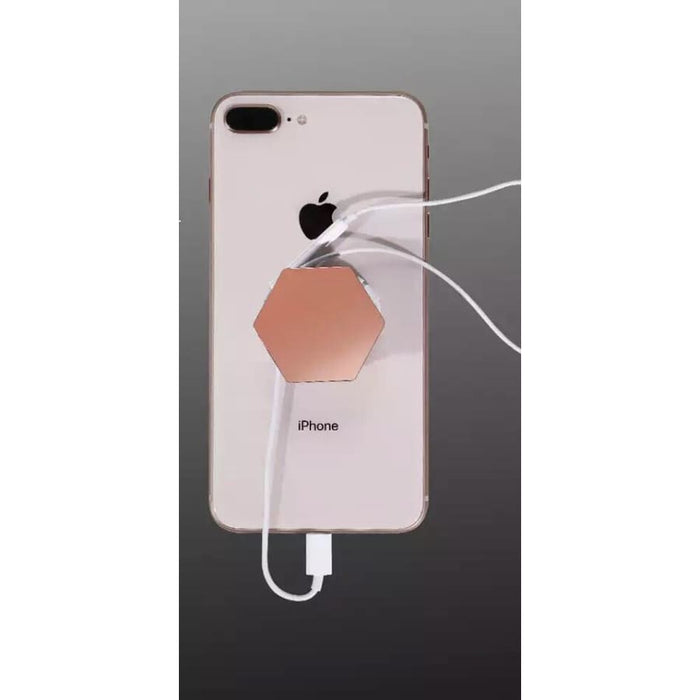 Glossy expanding finger grip for phones and tablets by 9eight5, showing its adjustable design and sleek surface.