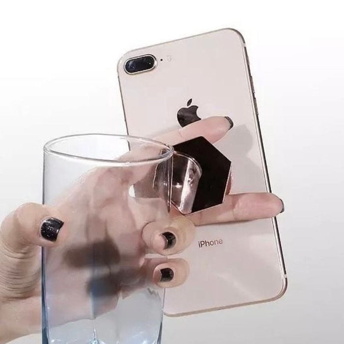 Silver expanding finger grip accessory for phones and tablets, 9eight5 brand, with a liquid white finish and adjustable design.