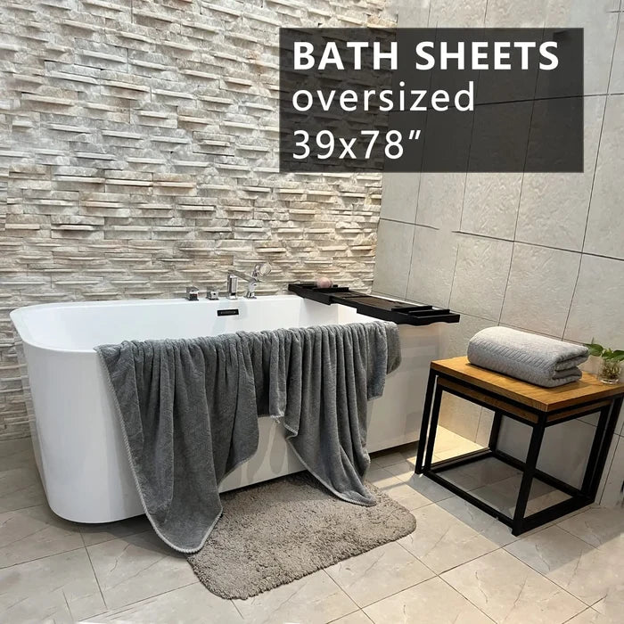 Extra large ShopHub NZ bath towel, 27x55 inches, soft and absorbent, shown folded on a clean bathroom surface.