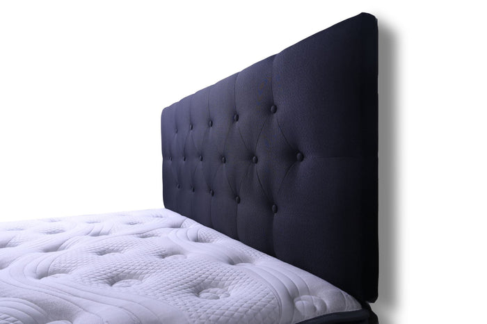 Black double Fenland headboard by sue-e furniture, showcasing a modern design with a padded, textured surface for a stylish bedroom look.