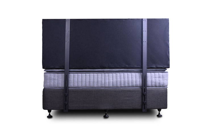 Grey double Fenland headboard by sue-e furniture, showcasing a modern, upholstered design with a smooth, padded surface.