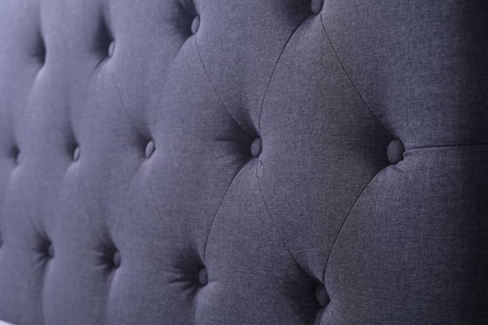 Grey double Fenland headboard by sue-e furniture, featuring a modern, upholstered design with a sleek, padded surface and clean lines.