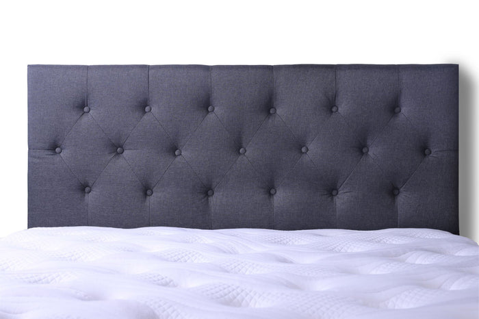 Grey king-sized Fenland headboard by sue-e furniture, showcasing a stylish, padded fabric design with a modern headboard appearance.