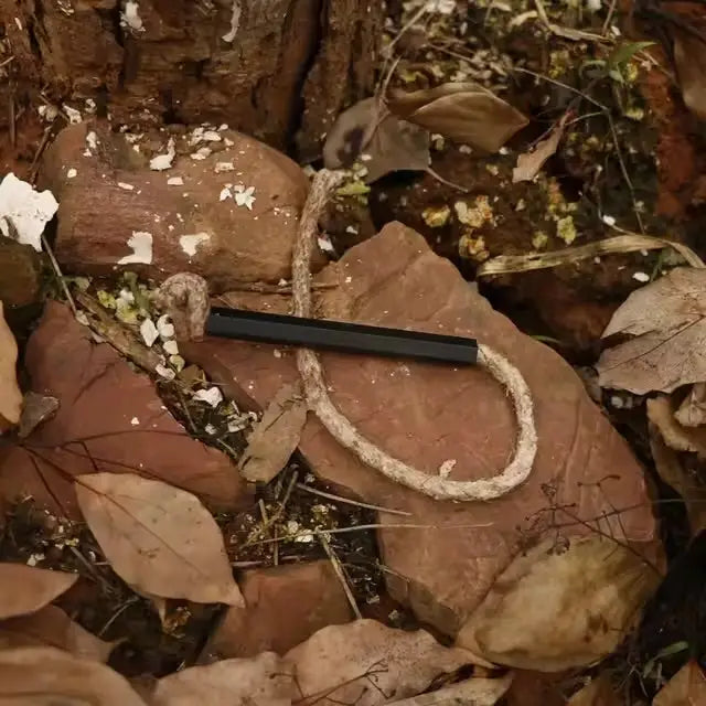 Habicare SS Fire Starter Tinder Cord coiled for easy lighting, ideal for camping and outdoor fire starting.