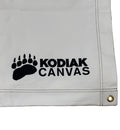 Kodiak Canvas tarp, durable white material with black logo and grommet for easy attachment.
