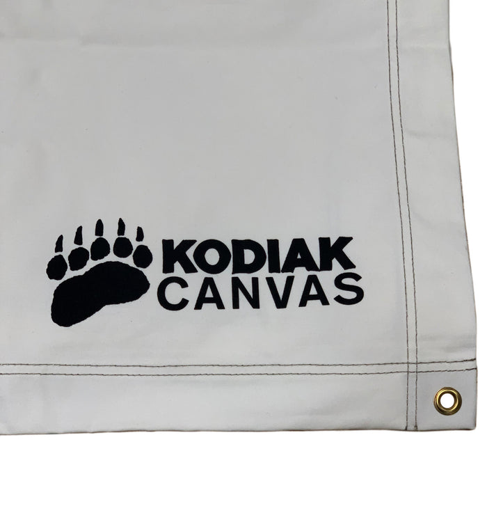 Kodiak Canvas tarp, durable white material with black logo and grommet for easy attachment.