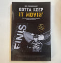 Book cover with text 'Gotta Keep It Movin'' and featuring athlete Ger Prendergast holding an Irish flag at the finish line of a race
